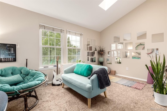 4636 S Dillon Ct Unit B, Aurora, CO 80015 - living area featuring baseboards, carpet flooring, a skylight, and high vaulted ceiling