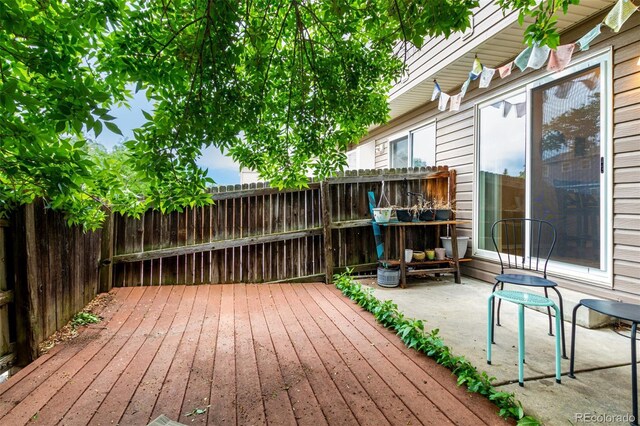 4636 S Dillon Ct Unit B, Aurora, CO 80015 - wooden deck with a patio area