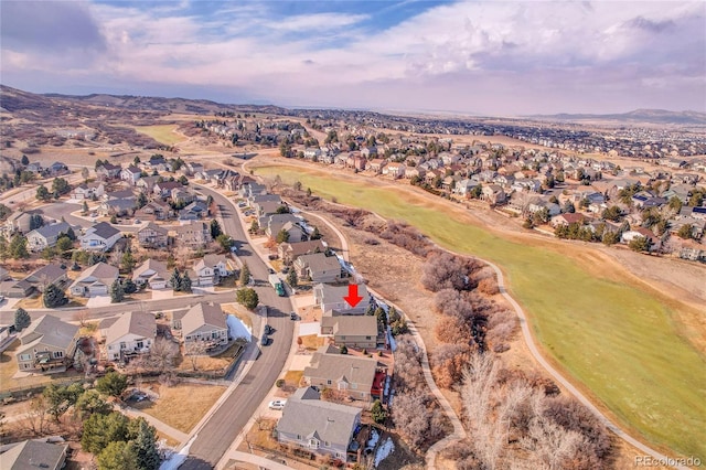 aerial view featuring a mountain view and a residential view