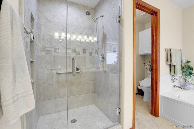 bathroom with a garden tub, toilet, visible vents, a shower stall, and tile patterned floors