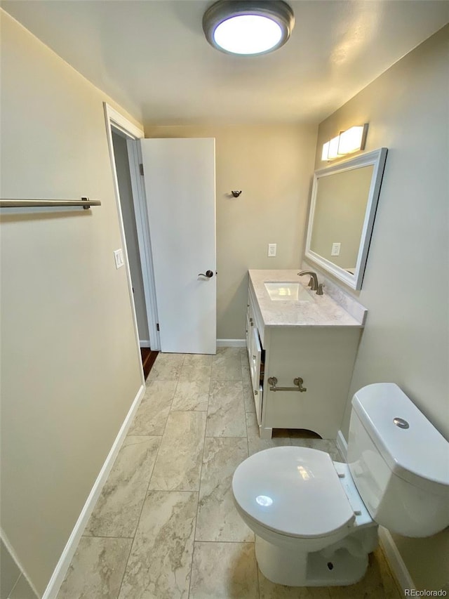 1243 Gaylord St Unit 302, Denver, CO 80206 - half bathroom with vanity and marble finish floors