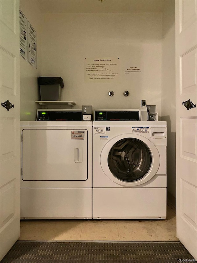 1243 Gaylord St Unit 302, Denver, CO 80206 - laundry room with washing machine and dryer and light tile patterned floors