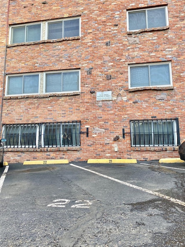 1243 Gaylord St Unit 302, Denver, CO 80206 - view of building exterior with uncovered parking