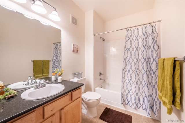 bathroom featuring toilet, shower / tub combo, vanity, visible vents, and tile patterned floors