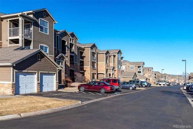 view of street featuring curbs and a residential view