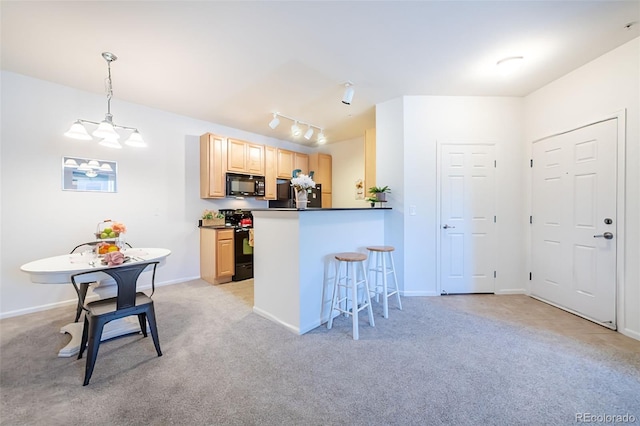 3100 Blue Sky Cir Unit 205, Erie, CO 80516 - kitchen featuring black appliances, light brown cabinets, dark countertops, a breakfast bar, and light carpet