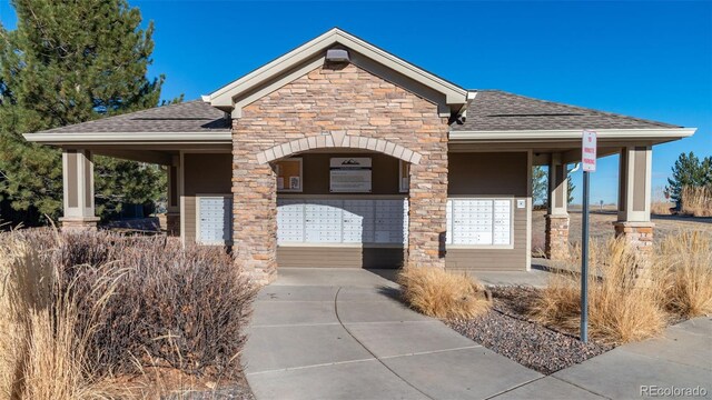 3100 Blue Sky Cir Unit 205, Erie, CO 80516 - view of front of house featuring stone siding and roof with shingles