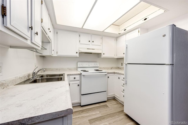 kitchen featuring sink, white appliances, white cabinets, and light hardwood / wood-style flooring