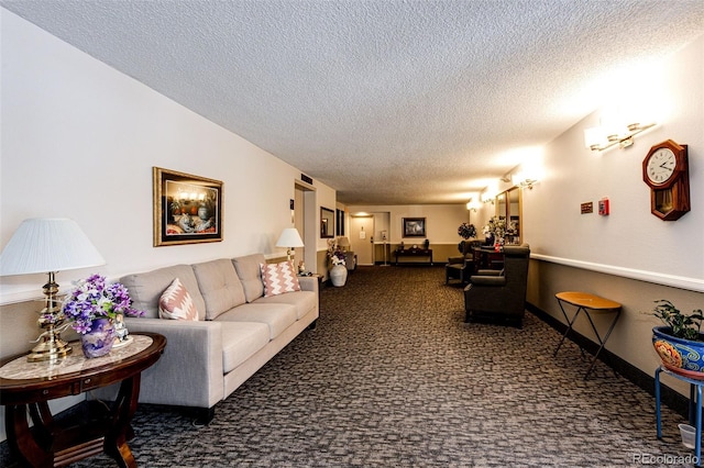 carpeted living room featuring a textured ceiling