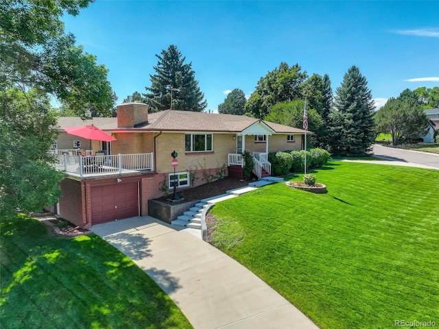 view of front of house with a front yard and a garage