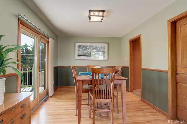 dining room with light wood-type flooring