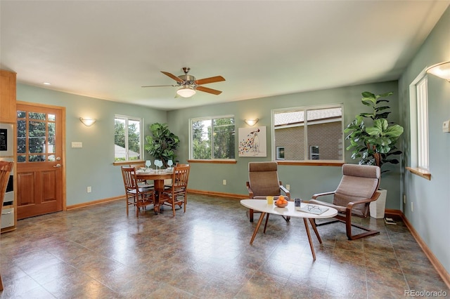 dining space featuring ceiling fan