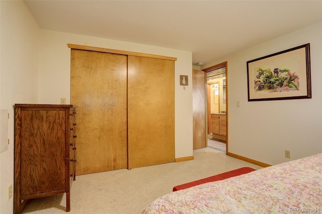 carpeted bedroom with a closet