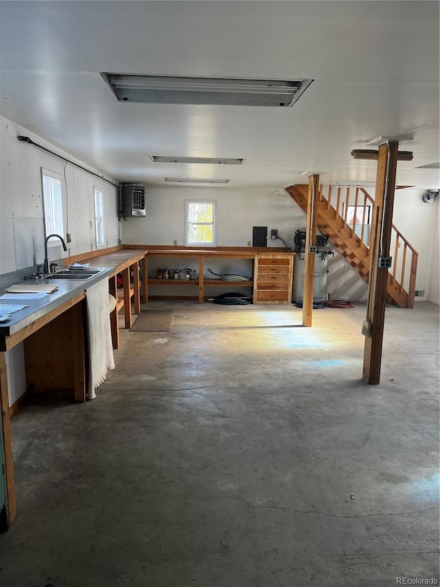 basement with sink and a workshop area