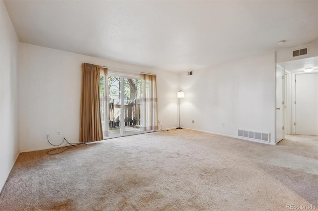 unfurnished room featuring carpet flooring and baseboards