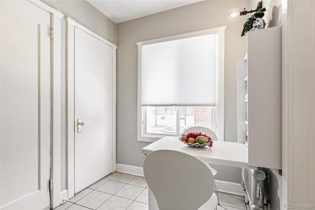 1416 N Downing St Unit 1, Denver, CO 80218 - dining area featuring light tile patterned flooring and baseboards