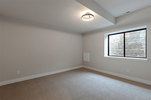 unfurnished room with carpet flooring