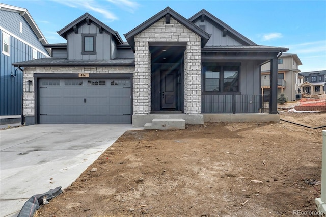 view of front of property with a garage and covered porch