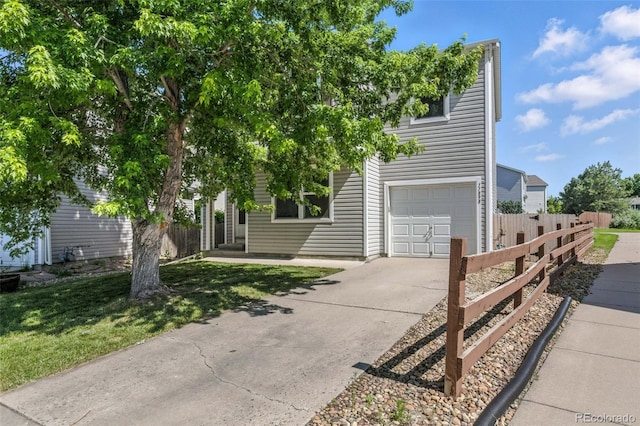 11898 W Tufts Pl, Morrison, CO 80465 - obstructed view of property with a garage and concrete driveway