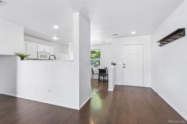 11898 W Tufts Pl, Morrison, CO 80465 - entrance foyer with dark wood-style floors and recessed lighting