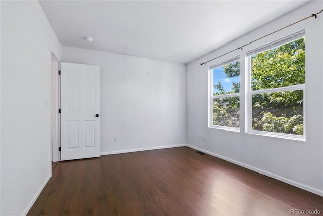 11898 W Tufts Pl, Morrison, CO 80465 - spare room with dark wood finished floors and baseboards