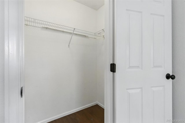 11898 W Tufts Pl, Morrison, CO 80465 - spacious closet featuring dark wood-style flooring