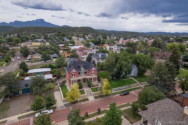 birds eye view of property with a mountain view