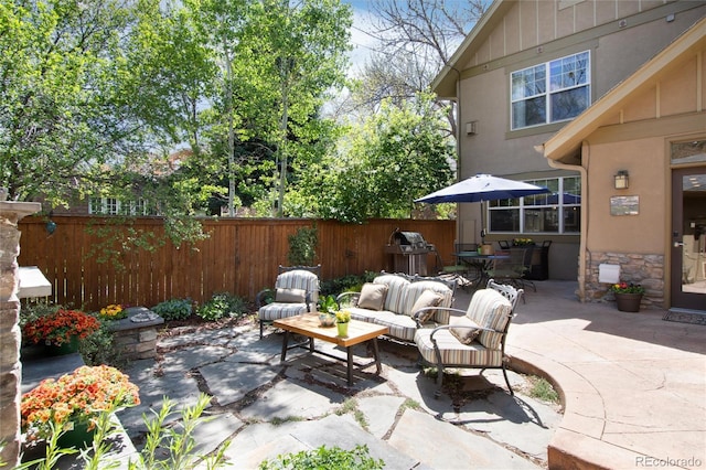 view of patio / terrace with fence and an outdoor hangout area