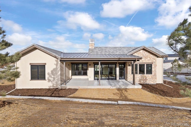 rear view of property with a patio