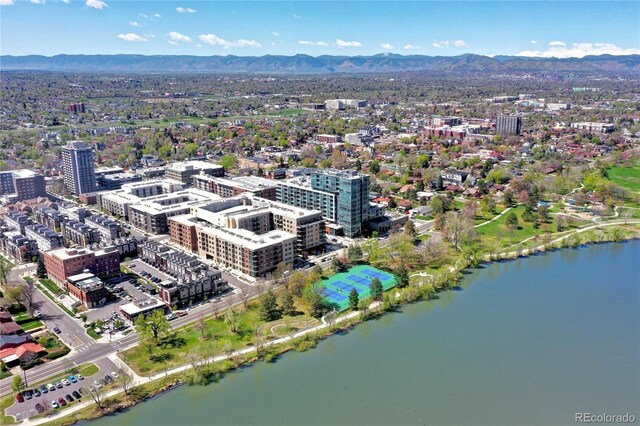 aerial view featuring a water and mountain view