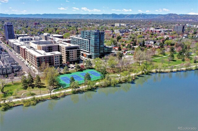 aerial view featuring a city view and a water and mountain view