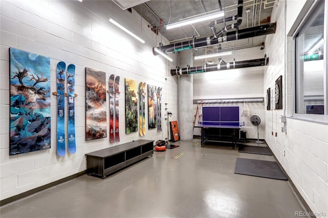 garage with concrete block wall