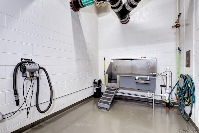 miscellaneous room with finished concrete flooring