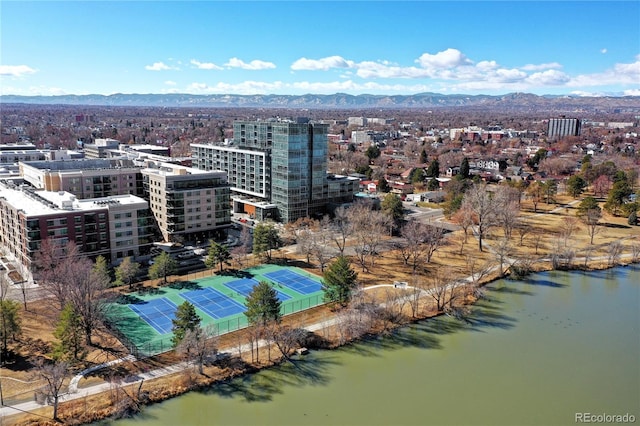 birds eye view of property with a view of city and a water and mountain view