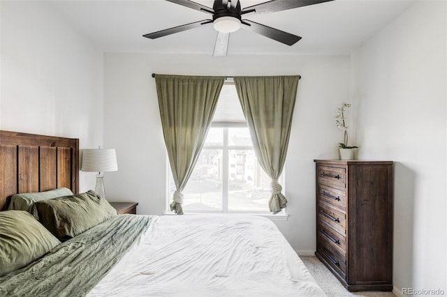 bedroom with ceiling fan and light colored carpet