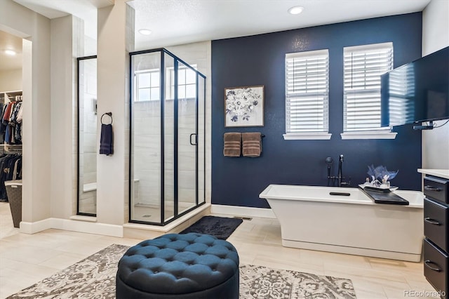 bathroom featuring shower with separate bathtub and a healthy amount of sunlight