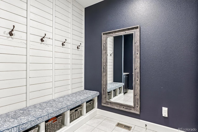 mudroom with light tile patterned floors