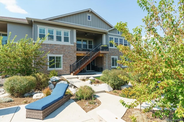 rear view of property featuring a balcony