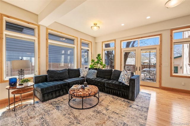 living area featuring hardwood / wood-style floors, french doors, baseboards, and recessed lighting