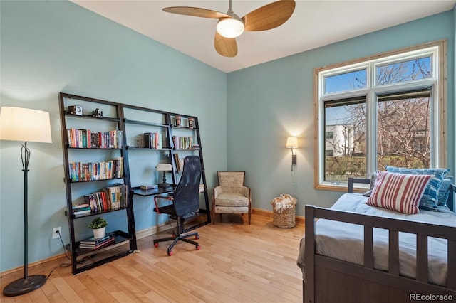 bedroom with wood-type flooring, baseboards, and ceiling fan