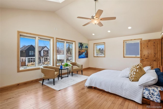 bedroom with a ceiling fan, baseboards, high vaulted ceiling, and light wood finished floors