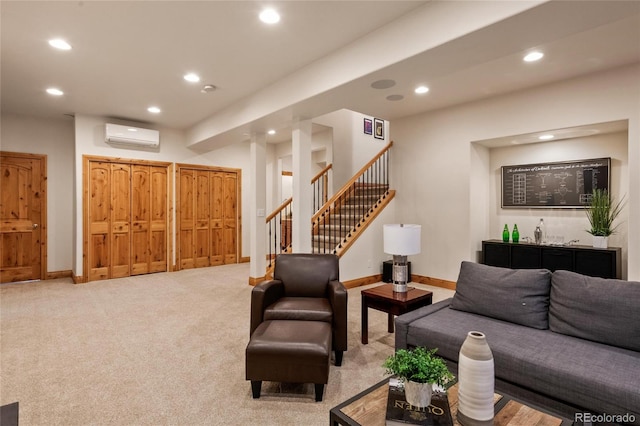 carpeted living area with a wall mounted air conditioner, recessed lighting, stairway, and baseboards