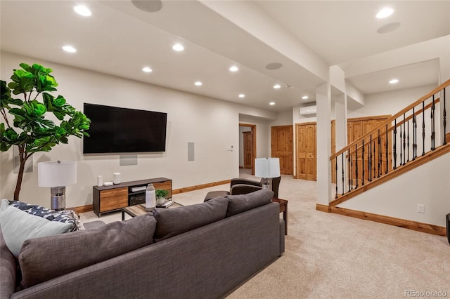 living room featuring light colored carpet, baseboards, stairway, and recessed lighting