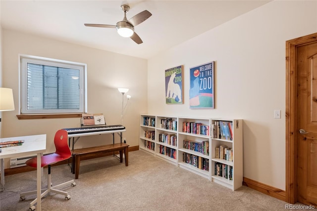 interior space with ceiling fan, baseboards, and carpet