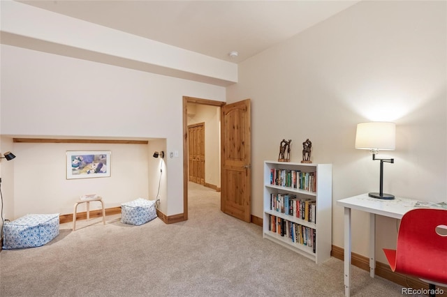 sitting room featuring carpet floors and baseboards