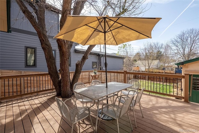 wooden terrace featuring outdoor dining space