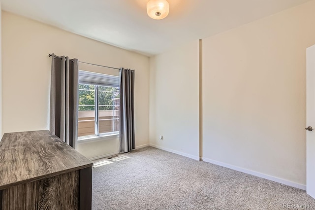 12856 Jasmine St Unit E, Thornton, CO 80602 - carpeted spare room with baseboards