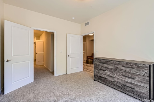 12856 Jasmine St Unit E, Thornton, CO 80602 - unfurnished bedroom featuring light colored carpet