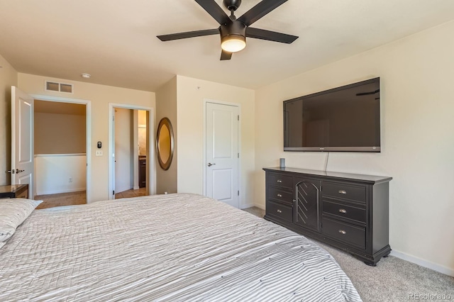 12856 Jasmine St Unit E, Thornton, CO 80602 - bedroom with light colored carpet and ceiling fan