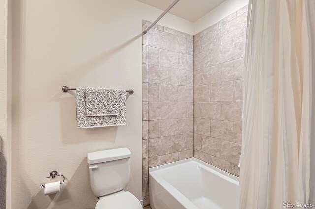 12856 Jasmine St Unit E, Thornton, CO 80602 - bathroom with toilet and shower / bathtub combination with curtain